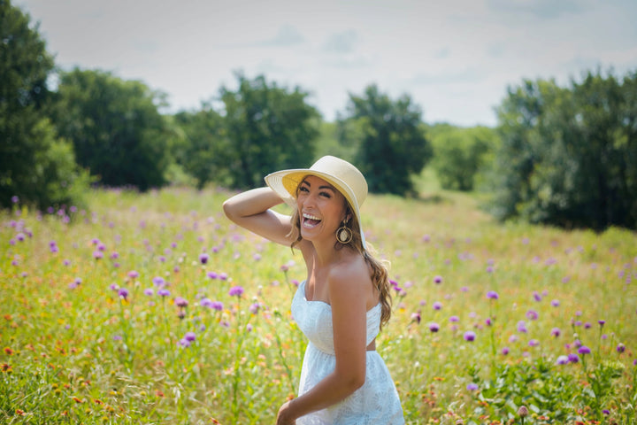 Woman in white dress with bright smile