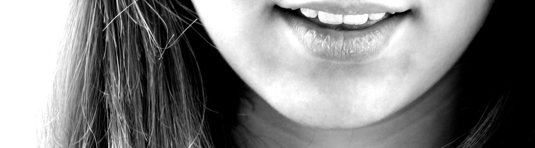 Teeth whitening pen being used